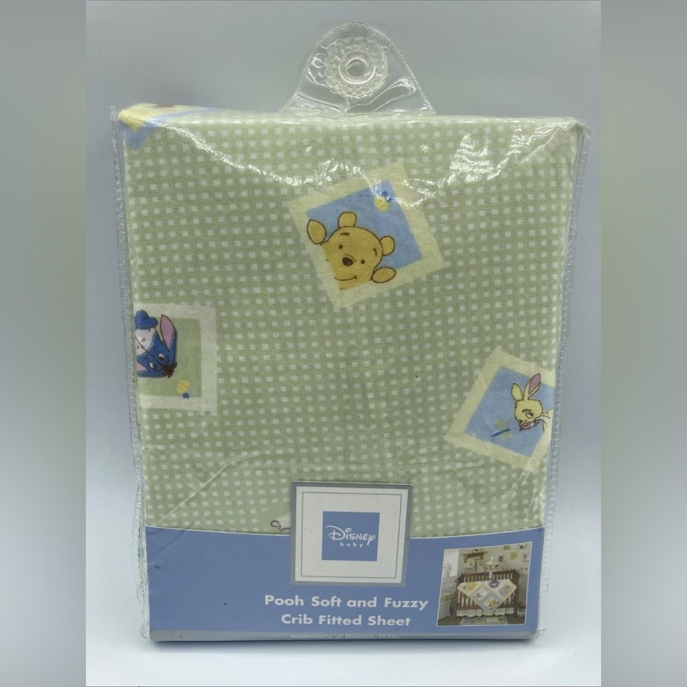 Disney Pooh fitted sheets for a baby crib.